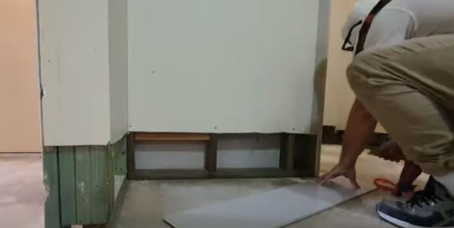 repairing drywall damaged by flood